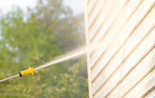 pressure washing a house